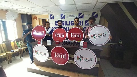 Raj Basu and others publishing the poster