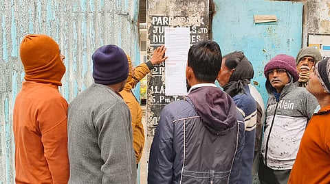 Workers protested against the 'temporary' status at the Kamarhati jute mill, blocking BT Road.