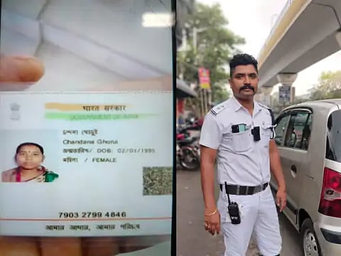 लोगों की मदद करने वाले ट्रैफिक सार्जेंट और महिला की तस्वीर