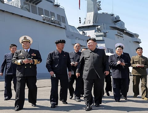 Kim Jong Un with officials during an inspection