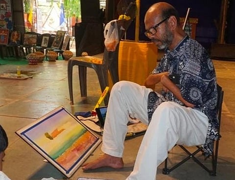 Specially Abled Ranjan Kurmi Paints with Feet in Howrah