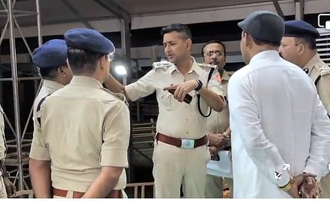 मंत्री दीपंकर जाना और पुलिस अधिकारी को सभास्थल का परिदर्शन करते हुए