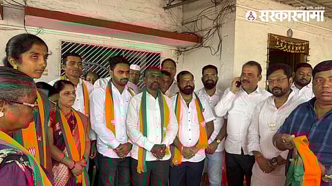 MP Dhairyasheel Patil and BJP leaders welcoming Shiv Sena and UBT group members who joined BJP during a political induction event in Sudhagad, Raigad.
