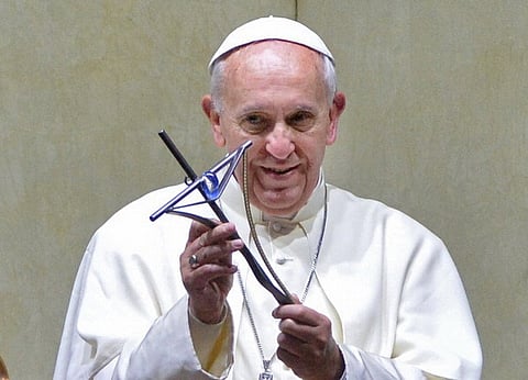 Pope Francis holds a cross during a meeting with cardinals and bishops at the Archbishop's Palace in Rio de Janeiro, Brazil on July 27, 2013. Pope Francis urged the Brazilian Roman Catholic Church on Saturday to win back believers who abandoned it for other religions or lost faith. AFP PHOTO / POOL - LUCA ZENNARO        (Photo credit should read LUCA ZENNARO/AFP/Getty Images)