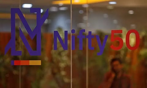 Nifty hits new high before closing at day’s low