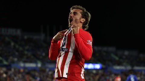 Antoine Griezmann scores hat-trick as Atletico beat Getafe to seal Champions League spot