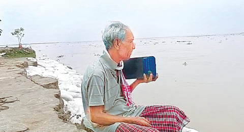 Dibrugarh: 70-year-old’s house swept away due to erosion but he held onto his radio set