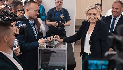 French parliamentary polls close with high turnout, exit poll indicates far-right tops vote share
