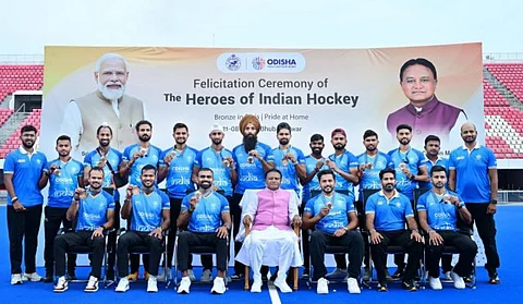 Odisha Chief Minister Mohan Charan felicitates Olympic Men's Hockey medalists