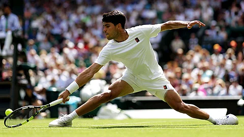 Wimbledon: Defending champion Alcaraz survives scare, Fonseca flies past Fearnley