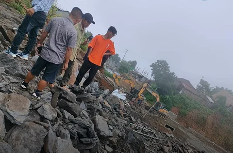 Locals taking a look at the major landslide site