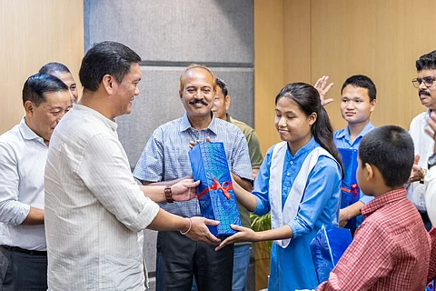 Arunachal Pradesh Chief Minister Pema Khandu handing over KIBO, a powerful AI-based reading device to disabled children