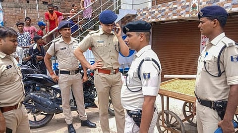 Delhi
Police personnel at the scene of crime.