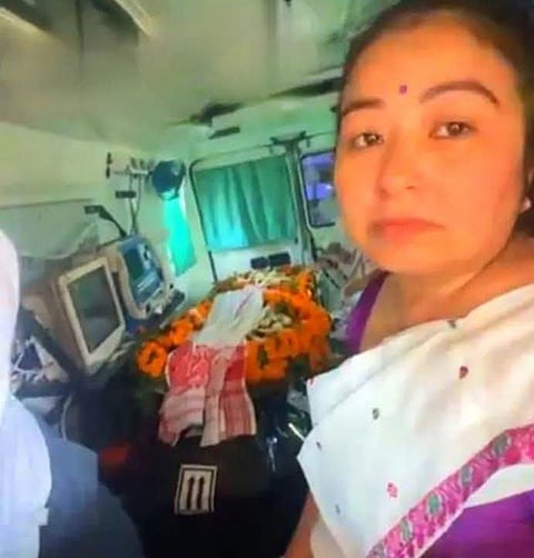 Image of Garima Garg inside the ambulance accompanying Zubeen Garg's journey to his residence in Kahilipara