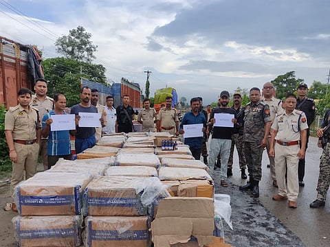 Image of the Illegal cough syrups after seizure alongside the accused persons