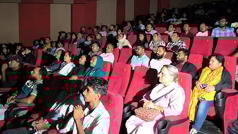 Image of people while watching Zubeen Garg's last film Roi Roi Binale