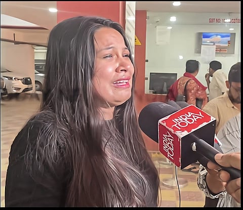 Image of an emotional fan, tears streaming down her face while talking about The Roi Roi Binale Cinema