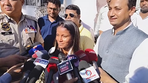 Image of Uma Chetry addressing the media.