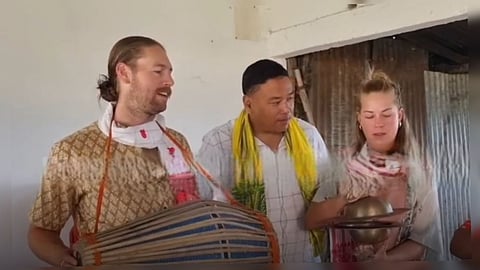 Image of the foreign tourist while exploring the rich culture of Assam's satra