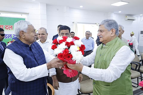 Image of Nitish Kumar felicitated by Minister Rajeev Ranjan Singh at the JD(U) legislative party meeting.
