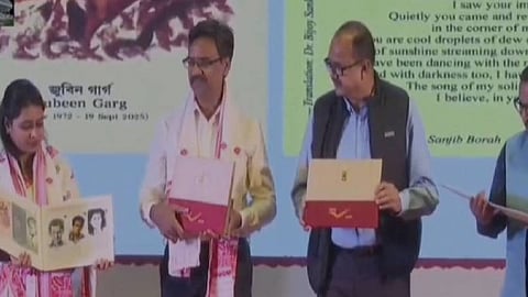 Image of the Indian Postal Department members during the release of a special commemorative postcard featuring the portrait of Assam's legendary artist Zubeen Garg in Howly Raax Mahotsav