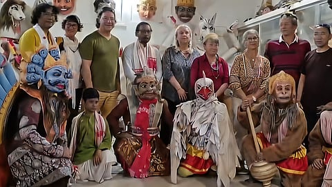 Image shows the foreign tourist posing for a photograph