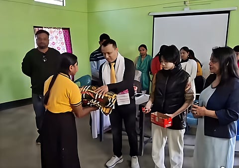 Imagesof Dr Arup Dutta distributing blankets to the specially-abled children at Chinatoli