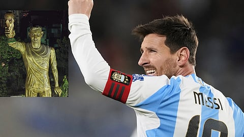 File photo of Messi on the right and his statue on the left