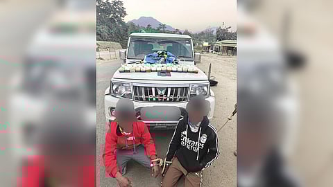 Image of the two drug peddlers and seized a huge quantity of brown sugar during a late-night operation in Dima Hasao