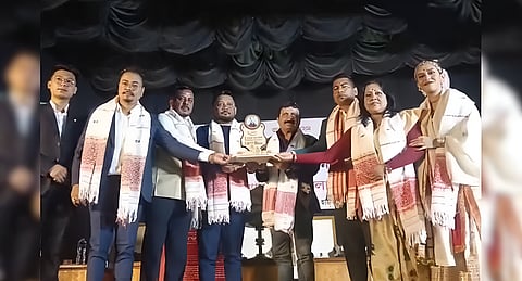 Image of Assam's prominent musician Diganta Bharati while receiving the Pankaj Bordoloi Memorial Award