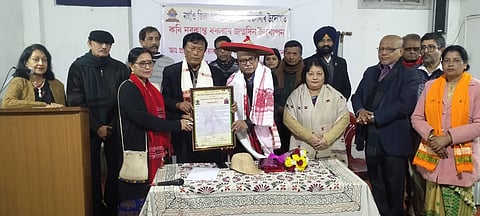 Image of prominent Assamese poet Dr Prayag Saikia while receiving "Kabyaratna" award