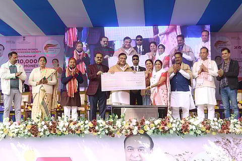 Image of Assam Chief Minister while distributing the MMUA cheques to the beneficiaries in Boko
