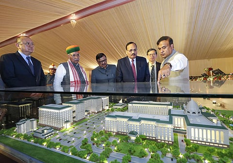 Image of Assam Chief Minister Himanta Biswa Sarma while describing the model to Chief Justice of India Surya Kant on the new Judicial Court Complex to be made in North Guwahati