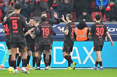 Leverkusen edge Hamburg to boost Champions League push