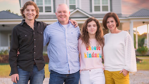 Dennis and Natalie Berry with their children, Chase and Juliana, on their family farm in Garland County.