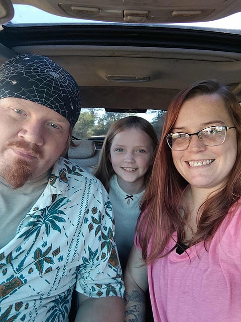 Joanna and her fiance and her daughter.