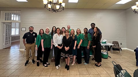 Crystal Regalado with UAM staff: Mary Whiting, Director of Admissions and Recruitment; Jessica Foxworth, Vice Chancellor for Student Affairs and Dean of Students; Quantel Williams, Assistant Dean of Students and Director of Housing and Residence Life; Emily Johnston, University Counselor; Dylan McClain, Director of Student Activities and Affairs; Dawn Reed, Assistant Vice Chancellor (Crossett campus); Althea Hayden, Financial Aid Coordinator; Kiara Palmer, Scholarship Coordinator; Dorissa Kaufman, Director of Adult Education; Cary Johnson, Assistant Vice Chancellor for Academic Success