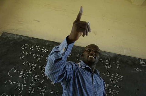 Winston Mills-Compton teaches a class in mathematics at the Mfantsipim Boys School in Cape Coast, Ghana, June 20, 2006. Mfantsipim is one of the oldest schools in Cape Coast, a town that prides itself as the academic center of the country. UN Secretary General Kofi Annan is one of the school's alumni.  (Photo by Jonathan Ernst)