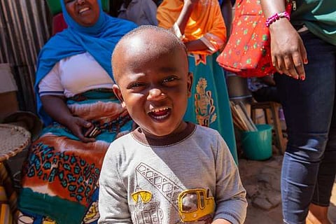 Market greeter. This young boy greeted us as we entered a local market, who can refuse this smile.