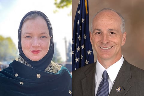 Side-by-side portraits of two individuals. The person on the left is wearing a black and gold headscarf with a calm expression, while the person on the right, dressed in a suit and tie, stands in front of a U.S. flag, smiling.