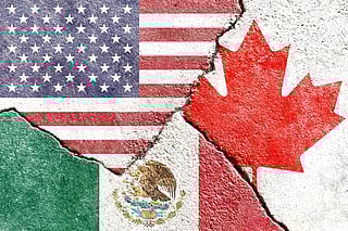 A cracked surface featuring the flags of the United States, Canada, and Mexico, each occupying a distinct section. The American flag is in the upper left, the Canadian flag in the upper right, and the Mexican flag at the bottom.
