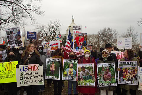 Protesters with signs gather at a rally in Washington, D.C., in support of the U.S. Agency for International Development.