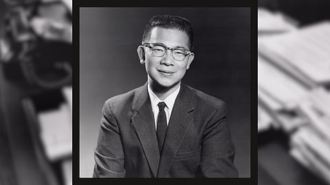 A portrait photo of Wing Luke, wearing a suit and glasses, smiling at the camera.