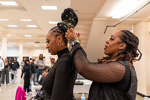 CieCie Retic (@thehaircoach) works on model Courtney’s hair during the Live Watch Me Work Loc competition at the Reign of Style Hair Show and Competition.