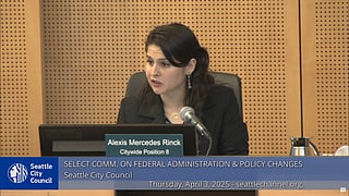 Alexis Mercedes Rinck speaks during a Seattle City Council meeting, seated at a desk with a nameplate identifying her as holding Citywide Position 8. The meeting, titled “Select Comm. on Federal Administration & Policy Changes,” took place on April 3, 2025, as shown in the overlay text.
