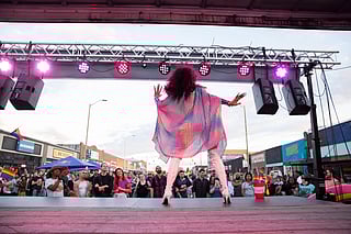 A performer takes the stage at White Center Pride.
