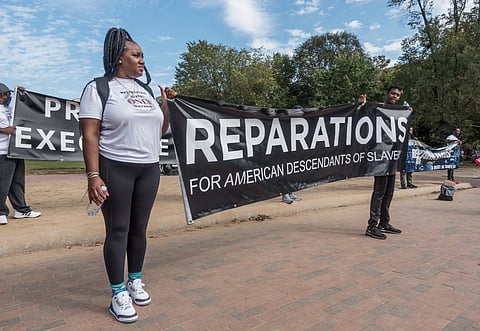 WASHINGTON, DC - OCT. 16, 2021: Activists demonstrate at White House demanding Pres. Biden sign an executive order to study reparations, and establish a commission for descendants of American slavery.
