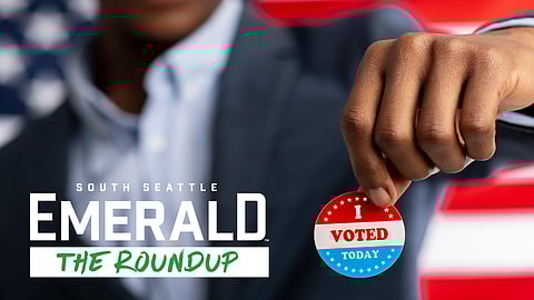 Unrecognizable african citizen of America holds I voted today button, typical of US elections on American flag.