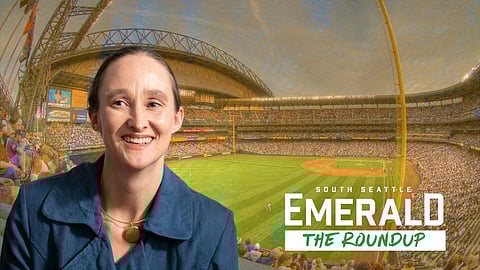Smiling woman in a blue jacket set against a packed baseball stadium, with infield and stands visible. Text reads ‘South Seattle Emerald — The Roundup.