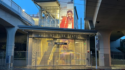 The Judkins Park Station with Hank Willis Thomas' artwork of Jimi Hendrix on the western facade and glowing in the dim light.